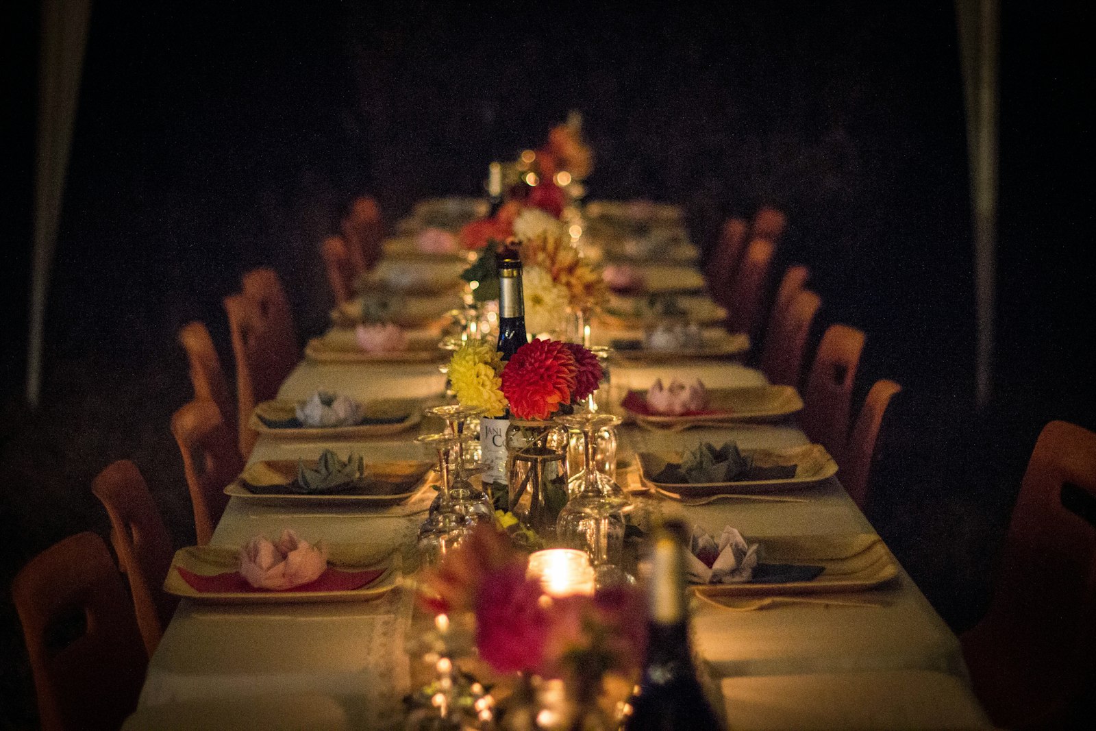An elegant dining table set with flowers and candles for a holiday private chef dinner in Los Angeles
