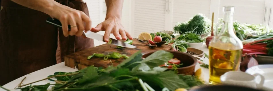 Private chef chopping fresh farmers market vegetables for a dinner in a Malibu home